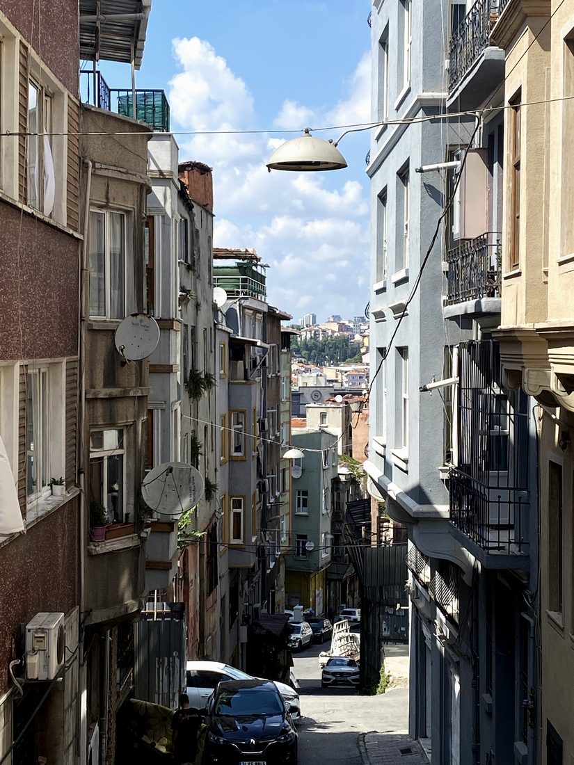 A steep Istanbul street falling away toward the water